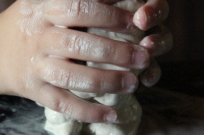 Hands working with slime