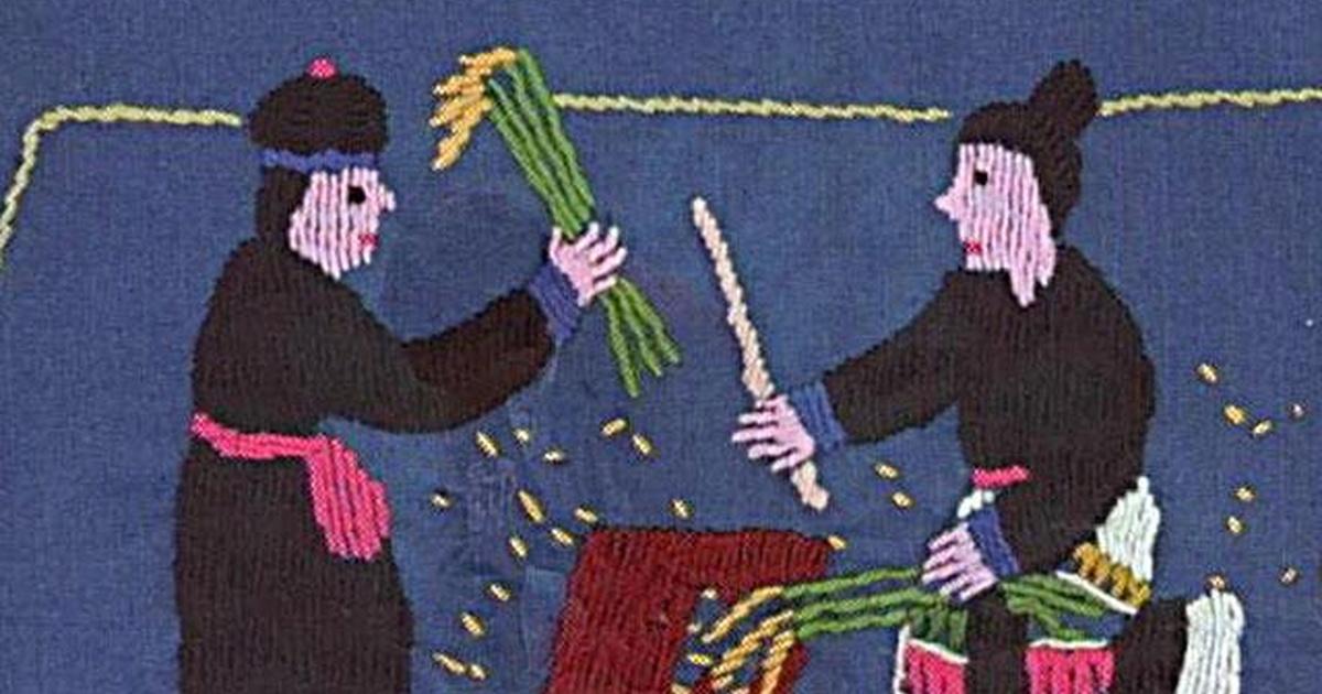 photo of embroidery work depicting two Hmong women