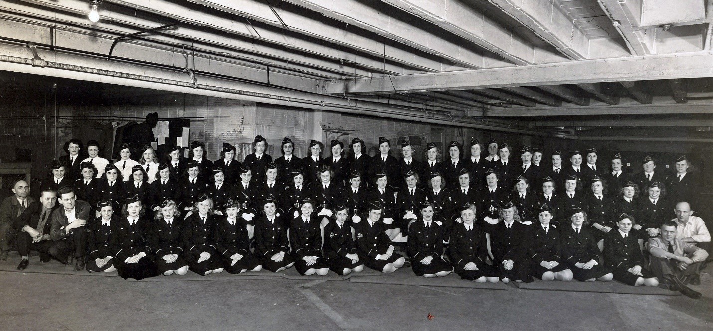 Black and white photo of approximately 50 women in uniform
