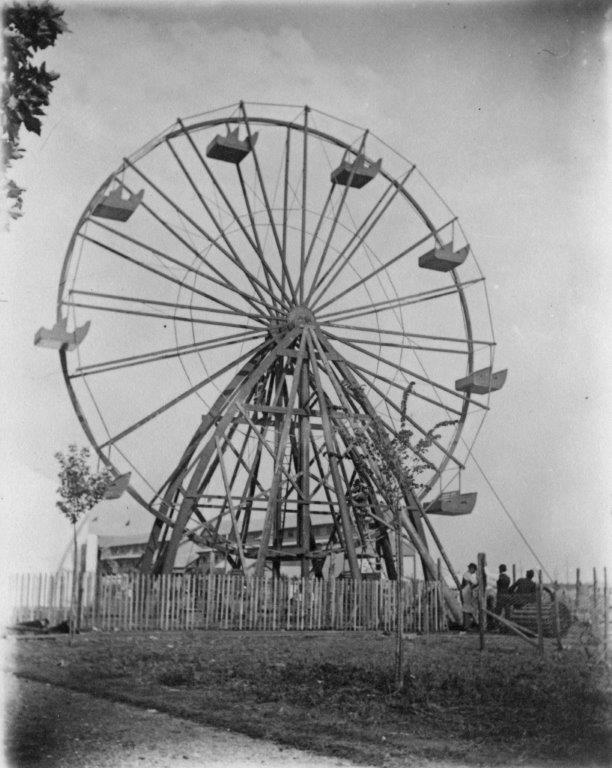 Black and white photo of an old ferris wheel