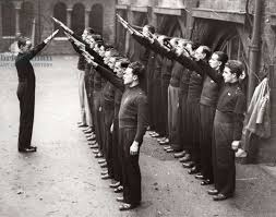 two rows of men with arms raised in fascist salute circa 1930s