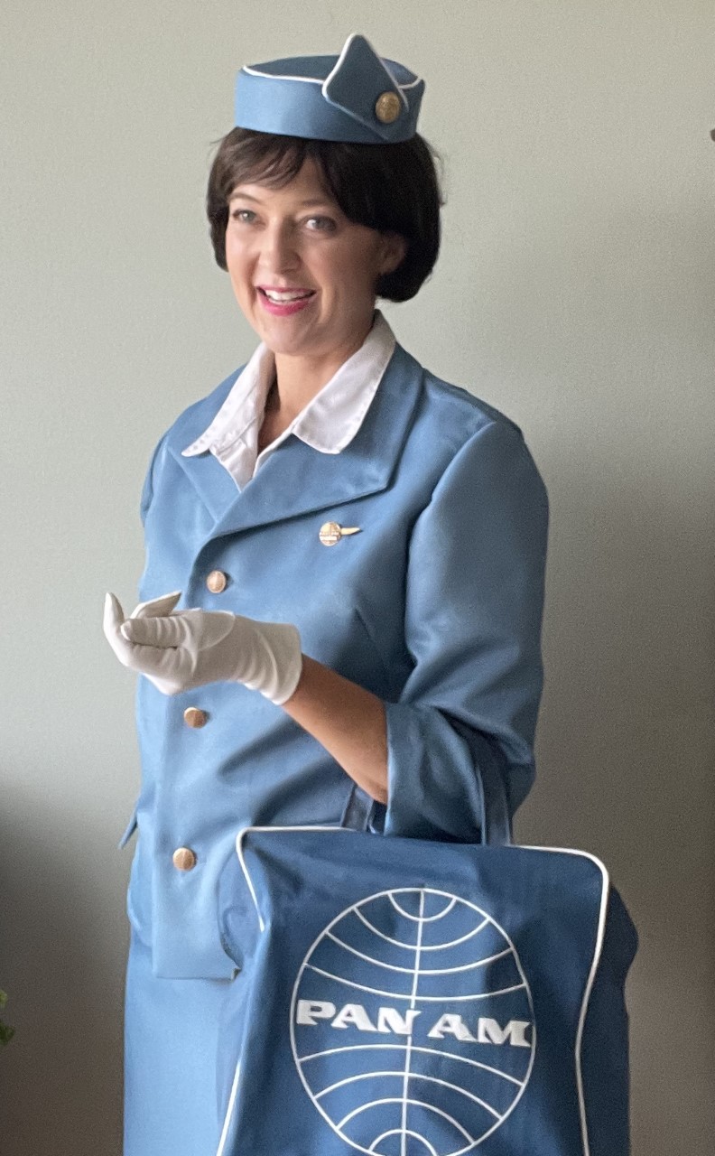 photo of Leslie Goddard dressed as an airplane stewardess from the 1960s
