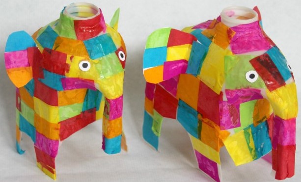Elephants made using milk jugs and covered with tissue paper
