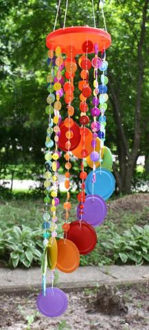 rainbow colors wind chime made out of buttons and canning jar lids 