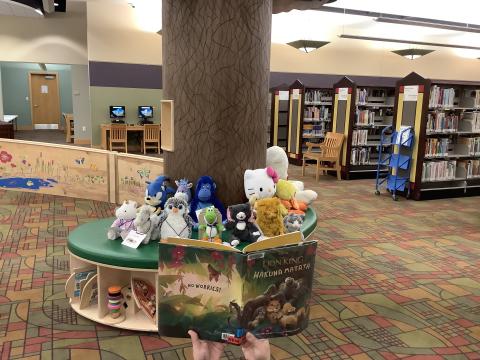 Stuffed animals listening to a story.