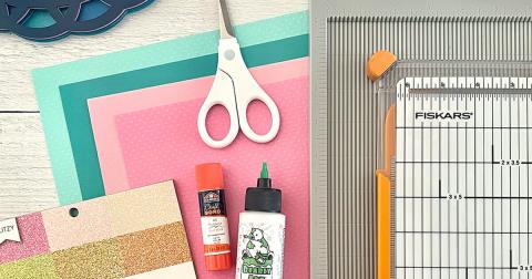 craft supplies, like scissors and glue and paper, spread out on a table