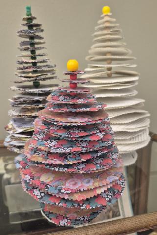 3 small pine trees made out of paper