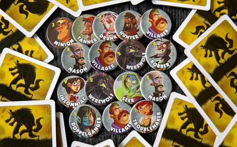 Small coins show different character possibilities, 16 in total, surrounded by yellow playing cards with a werewolf silhouette. 