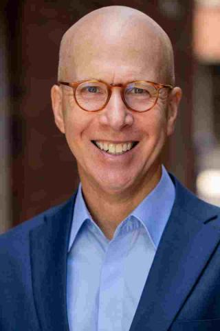 Jonathan Eig in a blue shirt and darker blue blazer