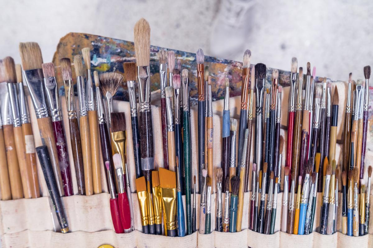 rows of paint brushes for art in various sizes and colors