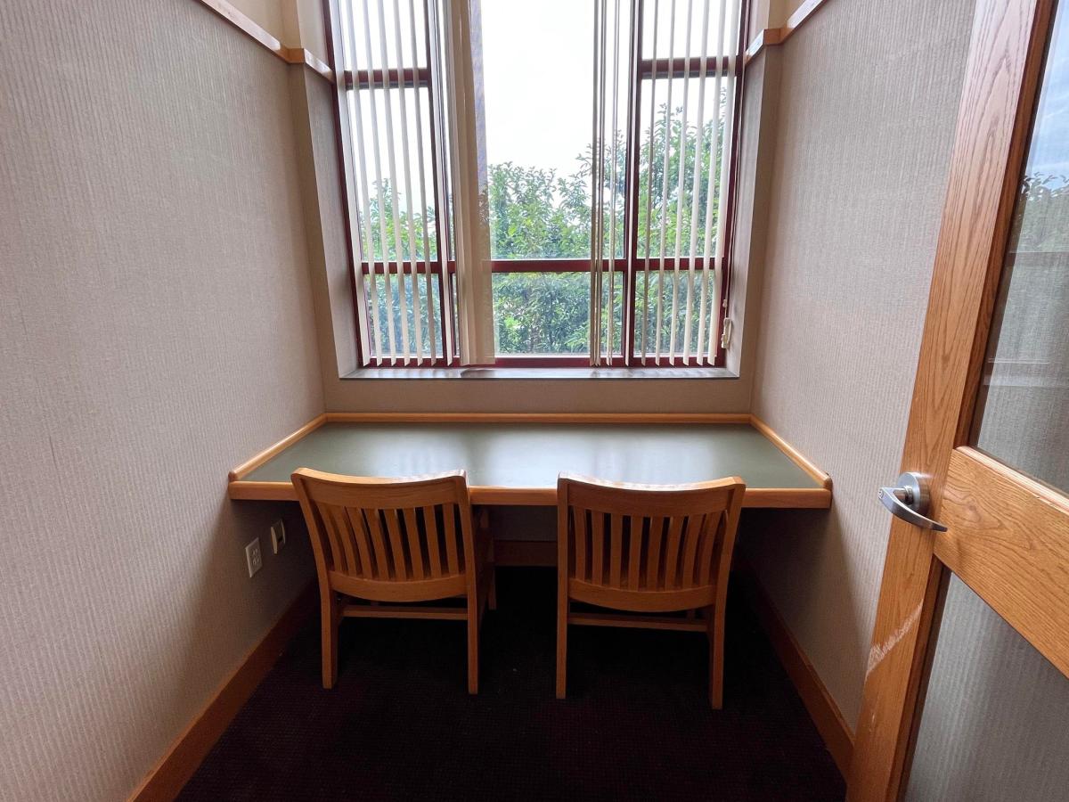 Study Room A - a small room with two chairs facing a desk