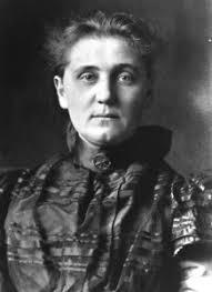 black and white photo of Jane Addams looking directly at the camera not smiling