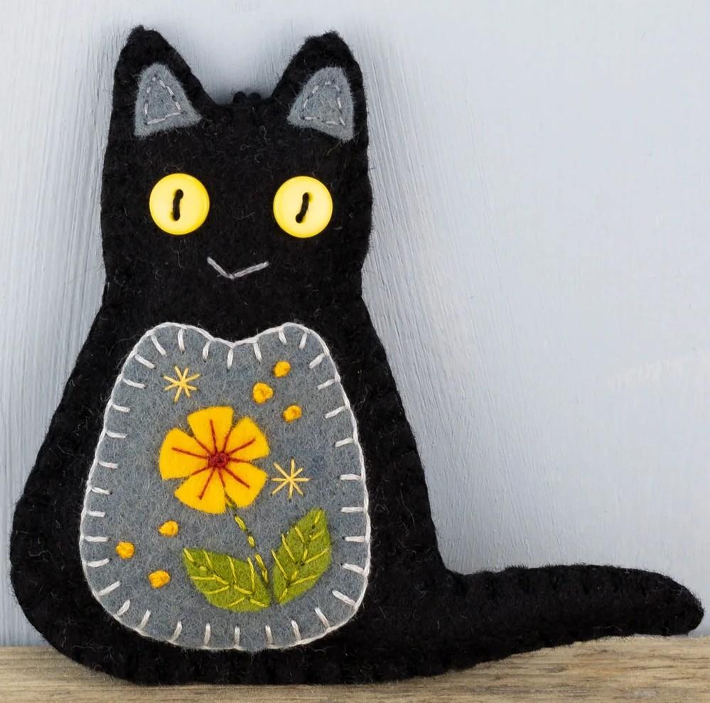 black cat made out of felt, a craft