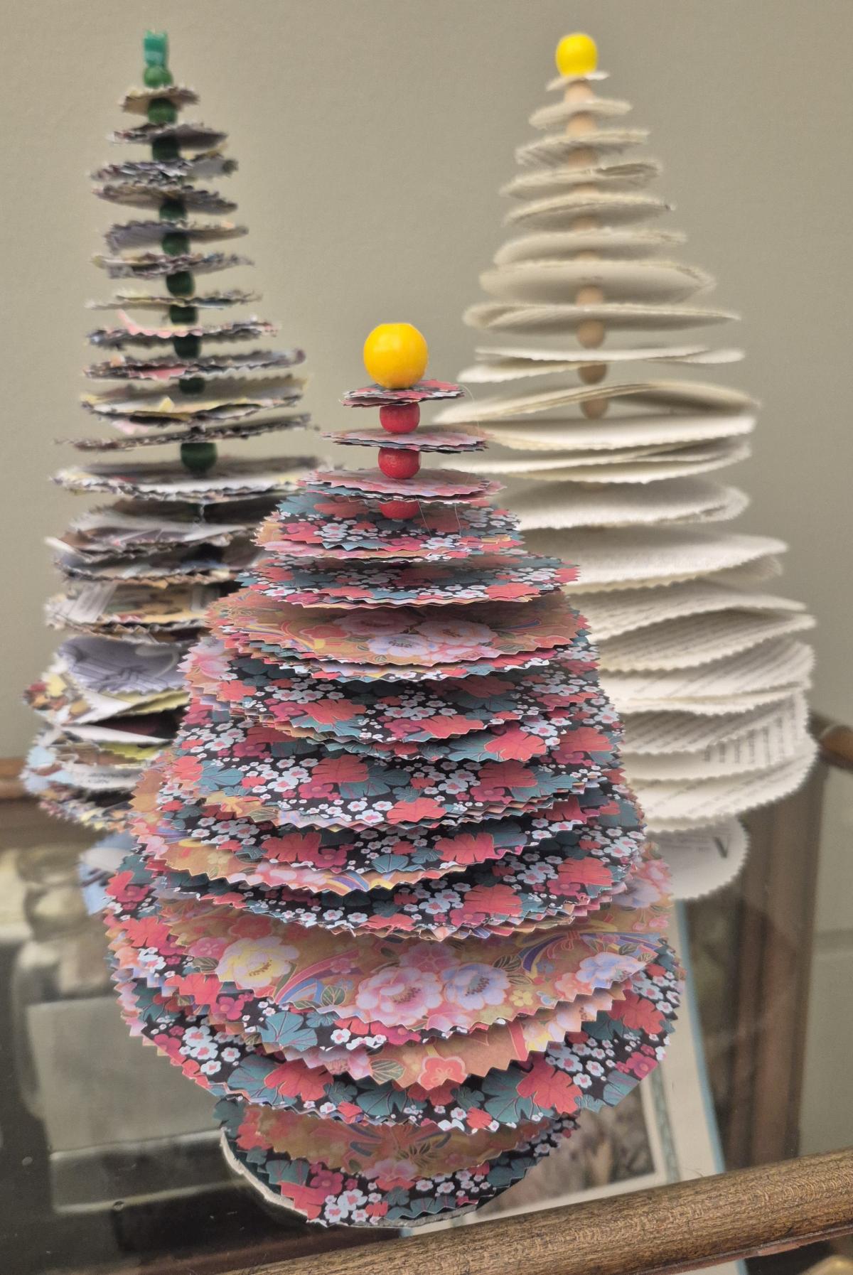 3 small pine trees made out of paper