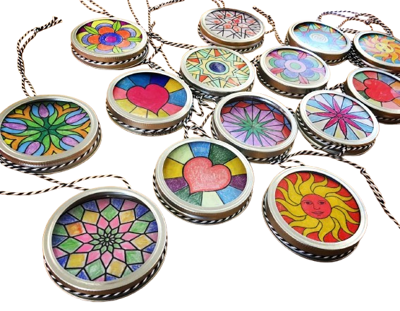 Suncatchers made using mason jar lids.